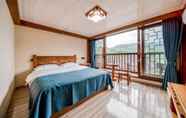 Kamar Tidur 3 Xijiang Village Vision Hotel