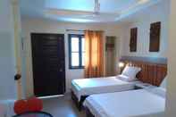 Kamar Tidur Ferellee Beachfront Inn