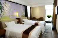 ห้องนอน Guangzhou Joyous Seasons Hotel