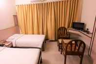 ห้องนอน Hotel Mangalore International