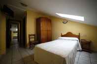 Phòng ngủ El Refugio Hosteria