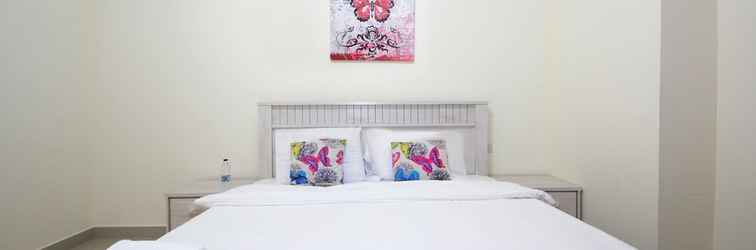 Kamar Tidur Signature Holiday Home - Red Residence