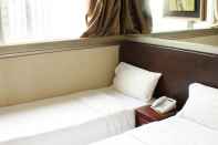 Bilik Tidur Oriental Lander Hotel