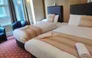 Kamar Tidur 7 The Palm Court Hotel