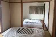 Phòng ngủ Homey Inn Enya