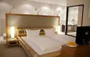 Kamar Tidur 4 Friendly City Hotel Oktopus