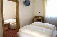 Bedroom Alpina Hotel