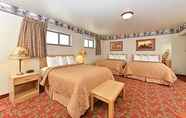 ห้องนอน 6 Harmony Inn & Suites