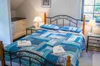 Kamar Tidur Whispering Pines Cottages