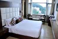 ห้องนอน Hotel Surya
