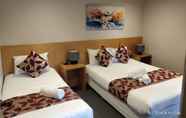 Kamar Tidur 3 The Coachman Motel & Units