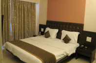 ห้องนอน Hotel Sunny International