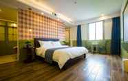 Kamar Tidur 3 Yuguo Hotel