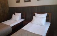 Bedroom 7 Gostinyi Dvor Galirad