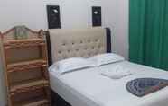 Kamar Tidur 4 Jingga Guesthouse