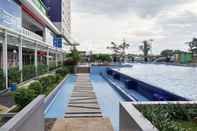 Swimming Pool Modern and Bright 2BR Green Pramuka Apartment