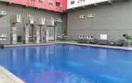 Swimming Pool 2 Homey 1BR with Spacious Living Room and Sofa Bed Green Pramuka Apartment