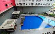 Swimming Pool 6 Homey 1BR with Spacious Living Room and Sofa Bed Green Pramuka Apartment