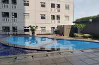 Swimming Pool Comfy and Clean 2BR Green Pramuka Apartment