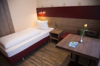 Kamar Tidur Alexander Business Hotel