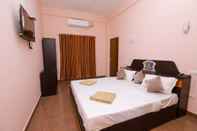 Bedroom Adona Residency - Hostel