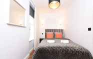 Bedroom 2 Stylish & Spacious Deluxe Apartments near Victoria Station