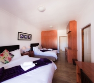 Bedroom 5 Nama White Guest House