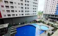 Swimming Pool 5 Homey and Relaxing 2BR Green Pramuka Apartment