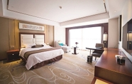 Bedroom 7 Days Hotel & Suites by Wyndham Jiangsu Xinyi