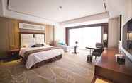 Bedroom 7 Days Hotel & Suites by Wyndham Jiangsu Xinyi