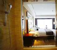 Phòng ngủ 4 Days Hotel & Suites by Wyndham Jiangsu Xinyi