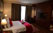 Bedroom 2 Ramada by Wyndham Gandhidham Shinay