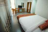 Kamar Tidur Present Hotel