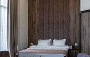 Bedroom 2 Ramada by Wyndham Shymkent