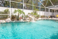 Swimming Pool 3 Bedroom Home With Private Screened Pool With Rock Waterfall Feature and Gameroom by Florida Dream Homes