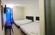 Kamar Tidur 6 Cattleya Glory Hotel