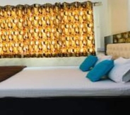 Bedroom 7 On The Ghat by Howdy Hostels