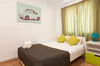 Kamar Tidur Centric Apartment Barna