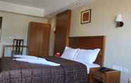 Kamar Tidur 5 Itsy By Treebo - Greenwood Inn And Suites