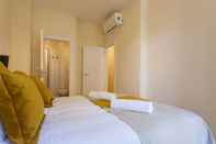 Bedroom ALTIDO Stylish 3BR Apt w/balcony in Graca, nearby Senhora do Monte viewpoint