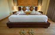 Kamar Tidur 7 The Mudru Resort