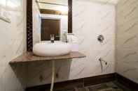 In-room Bathroom Ashapura Niwas by Vista Rooms