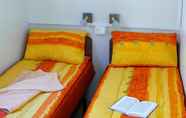 Phòng ngủ 4 Victoria Mobilehome Stella del Sud Camping Villaggio