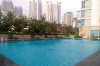 Swimming Pool Minimalist 2BR Apartment at Springhill Terrace Residence