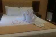 ห้องนอน Hotel Asliya Regency