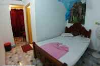 ห้องนอน Dilshan Guest House