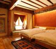 Bedroom 4 Tibetan-style Courtyard Hotel