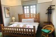 Bedroom Fantrip Homestay - Hostel