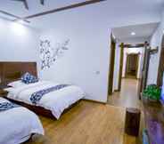 Bedroom 4 Floral Hotel · Spring Guesthouse Zhangjiajie