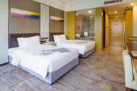 ห้องนอน Tianyuan Junlong Hotel